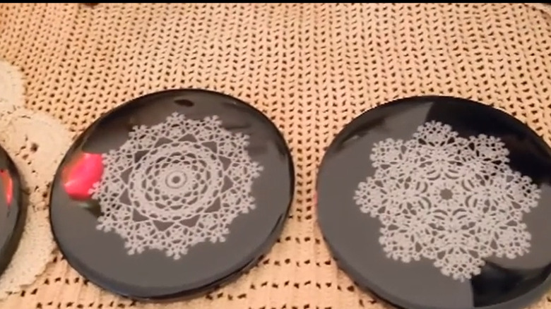 Coasters made with small white doilies placed in resin