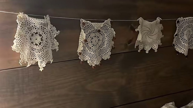 Doily banner hung on headboard