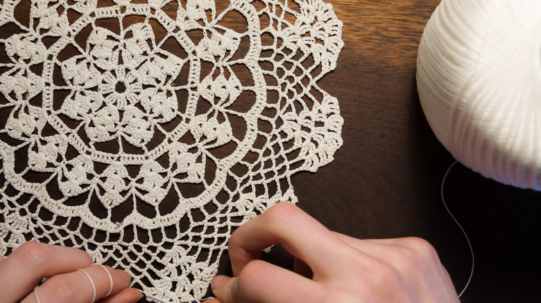 Woman with vintage doily and ball of string