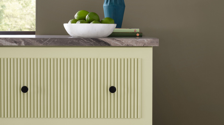 Sherwin-Williams 2027 Color of the Year, Celery, on fluted kitchen cabinets