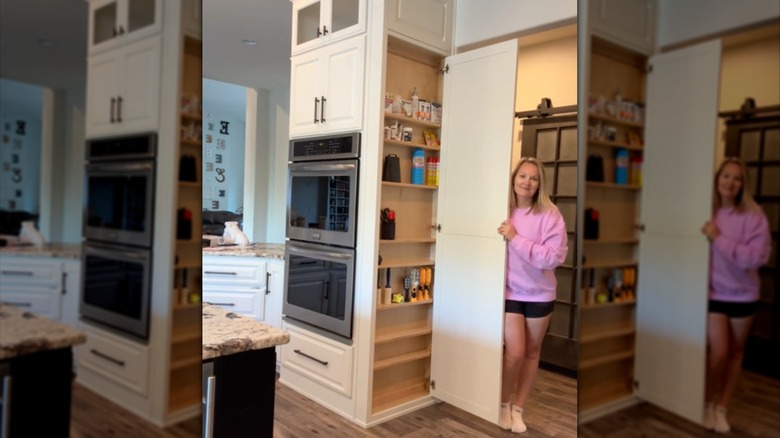 Custom hidden shallow clutter cabinet installed next to a double oven