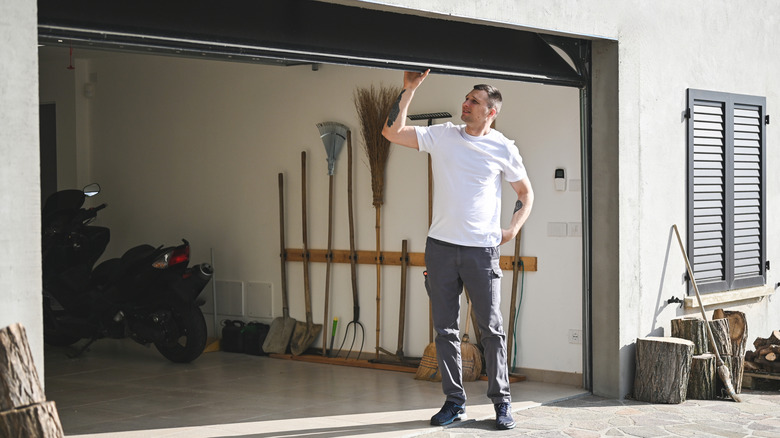 Man fixing garage door