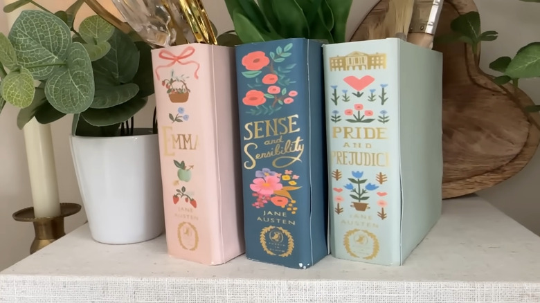 DIY faux book storage bins sitting on a table