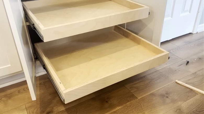 Set of matching pull-out shelves in a kitchen cabinet