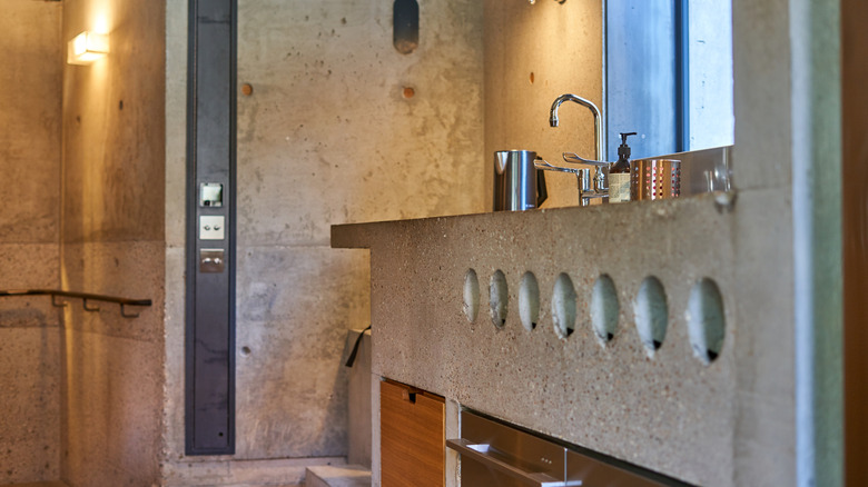 Industrial-style bathroom with a concrete sink