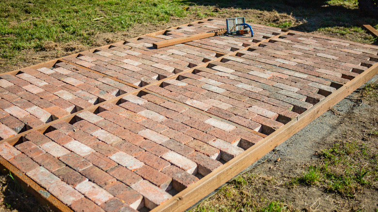 Reclaimed bricks being used in new patio construction