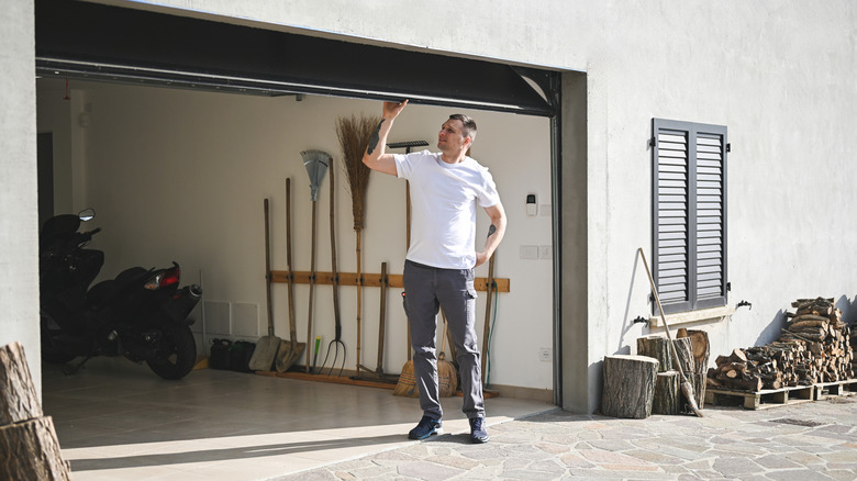 Man opening garage door