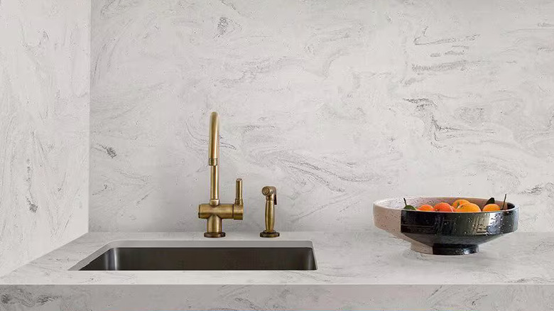 Limestone Prima solid surface countertop installed on countertop and backsplash