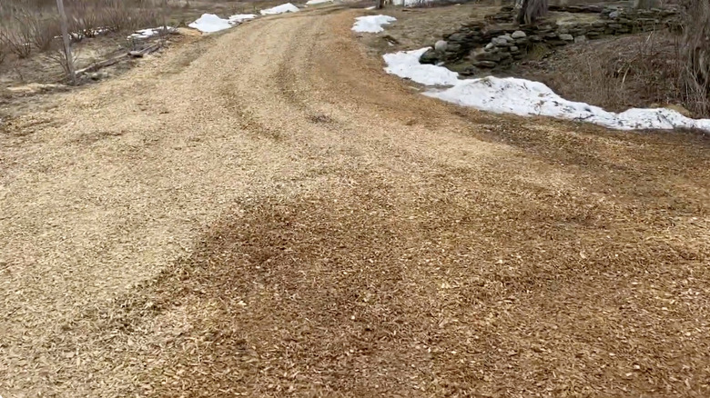 A driveway made from wood chips.