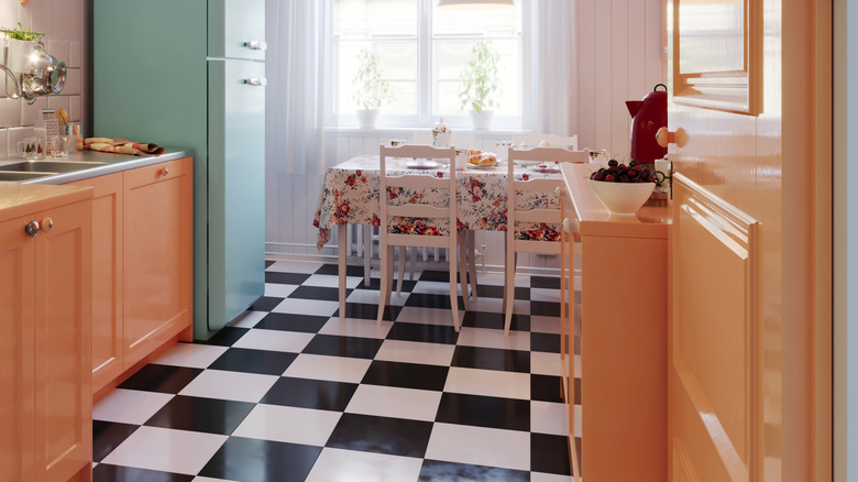 Retro kitchen with a classic black and white floor design.