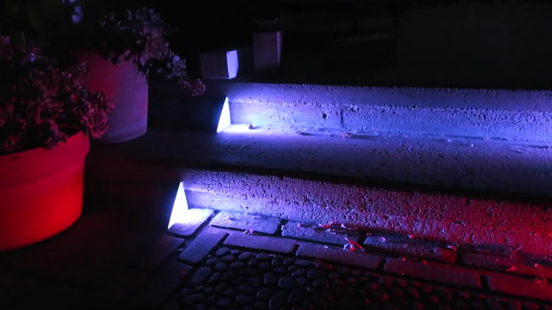 Solar stair lights lit up at night.