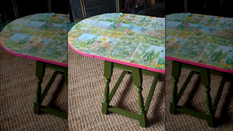 A table decoupaged with colorful book pages
