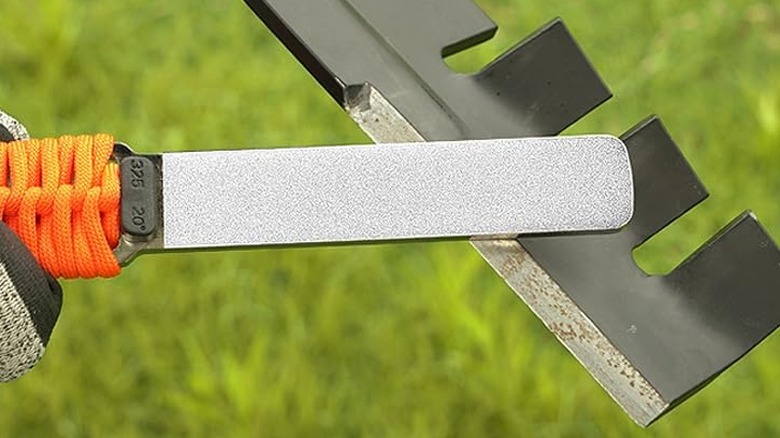 Sharpal diamond sharpening stone file with paracord handle restoring a lawn mower blade