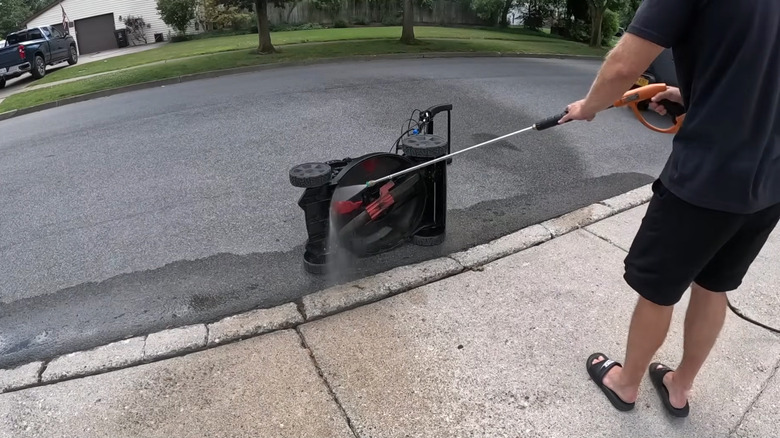 Pressure-washing the underside of a mower deck