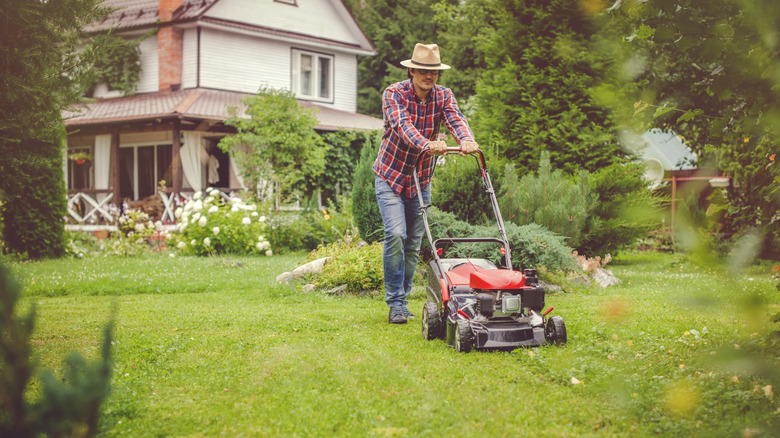 A man mowing the lawn.