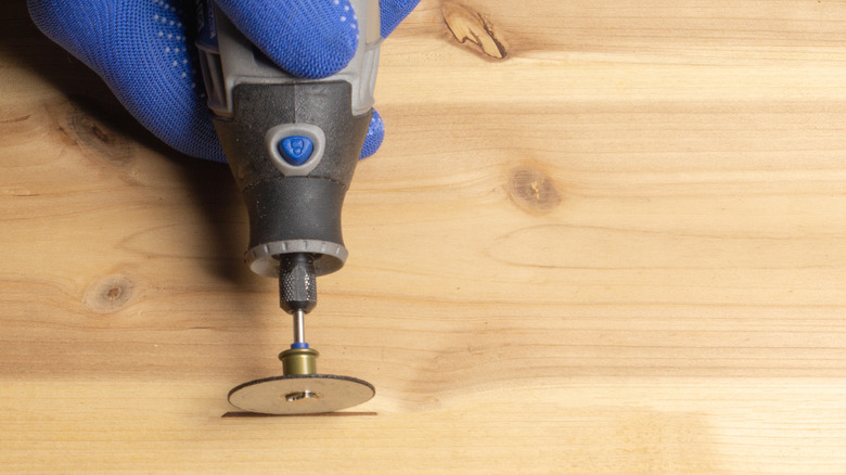 Cutting into wood with an abrasive wheel