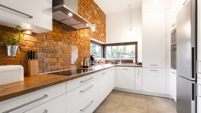 Kitchen with brick backsplash