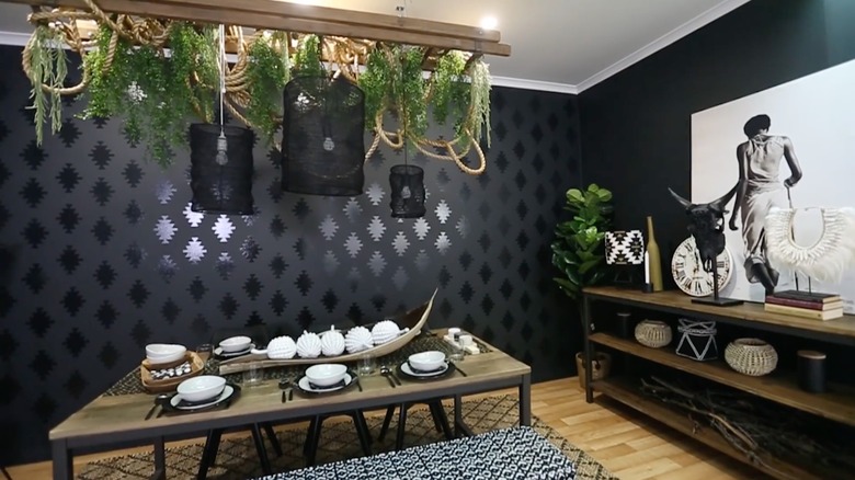 Glossy stenciled accent wall on matte background in contemporary dining room