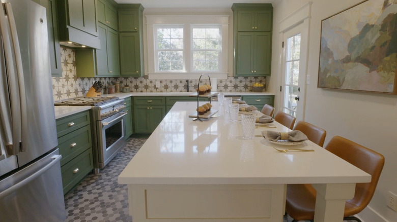 Erin Napier's kitchen renovation featuring star tile backsplash and green cabinetry