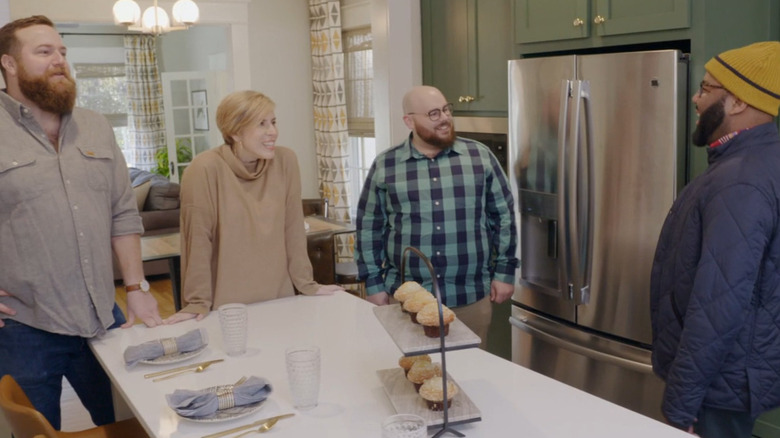 Erin Napier discussing a kitchen makeover with clients