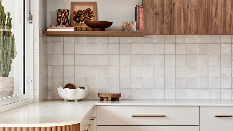 a cozy boho kitchen with white zellige tiles