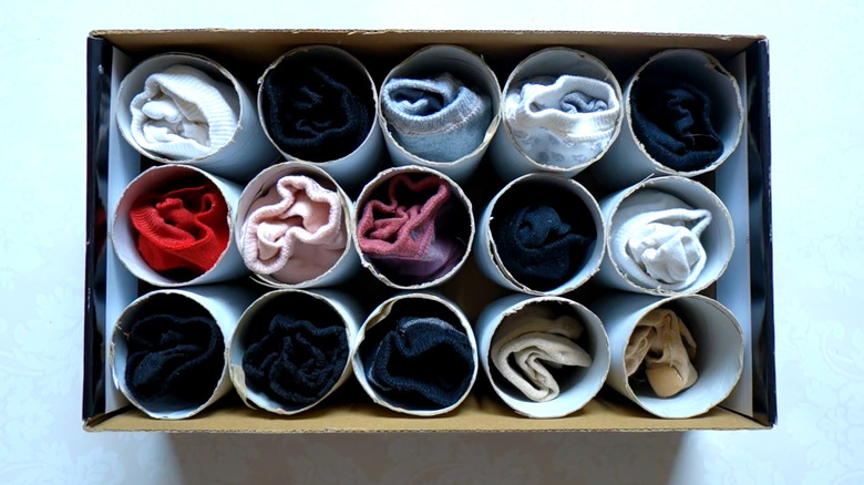 Toilet paper rolls with socks inside