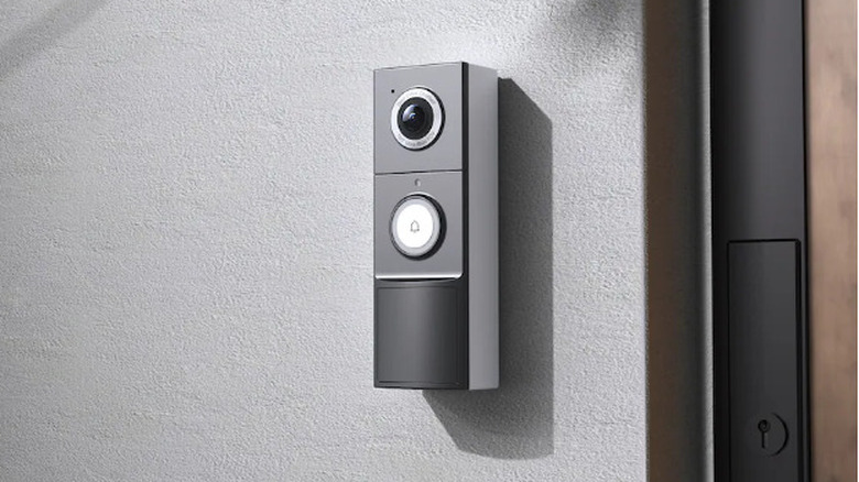 A TP-Link Tapo TD25 video doorbell on a wall