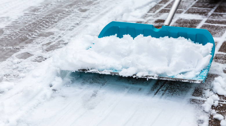Snow stuck to shovel