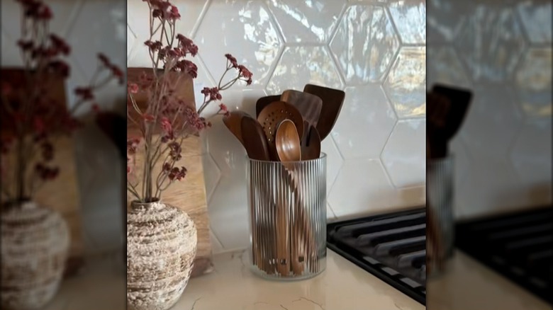 Ribbed Dollar Tree vase used as a utensil holder on a countertop