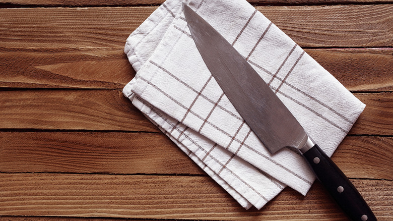 Dull knife sitting on a cotton towel