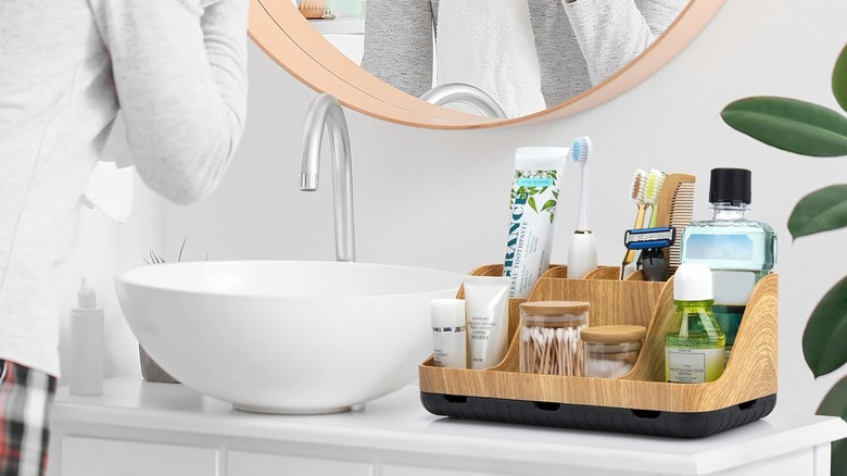 GFWARE Bathroom Organizer on counter with personal care products inside