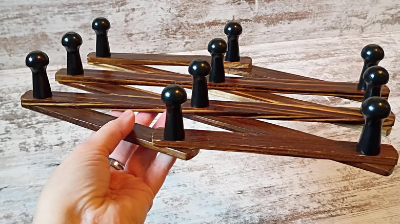 Woman holding an accordion rack