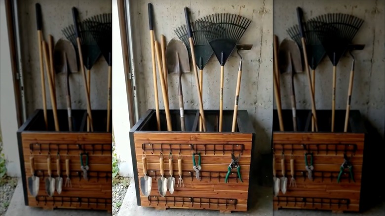 Garden tools are stored inside and hanging from a repurposed metal filing cabinet