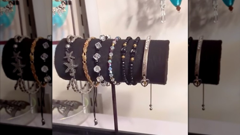 Long, narrow prescription container redesigned as classy bracelet holder for vanity