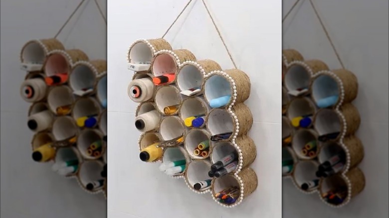 Tin cans turned into hanging storage solution