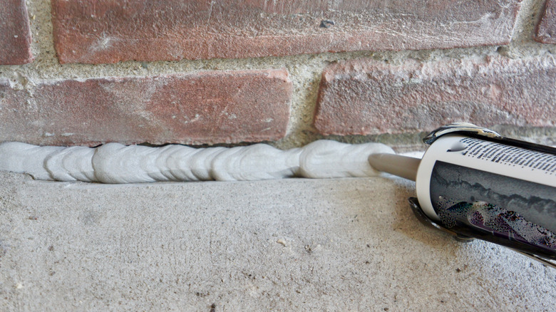 Filling a gap with concrete caulk