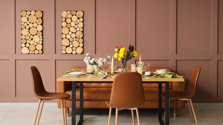 Dining room with earthy brown walls and chairs