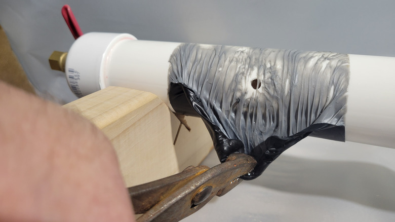 Gooey butyl tape adhesive on a PVC pipe