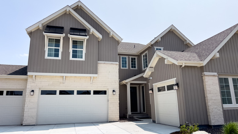 Simple driveway of a gray home