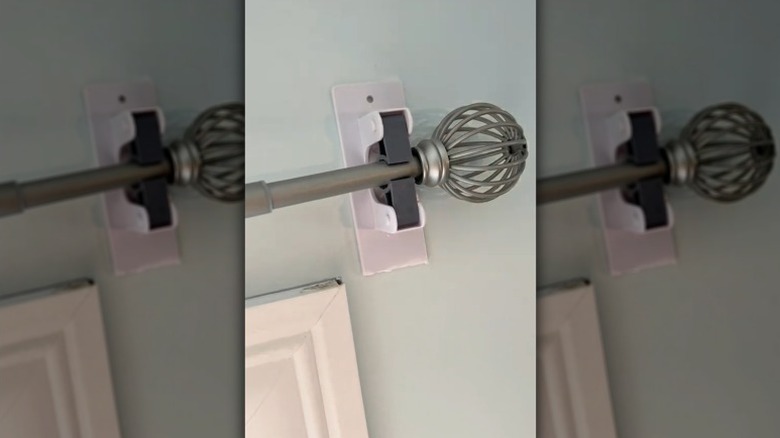 Dollar Tree mop hanger used as curtain rod holder