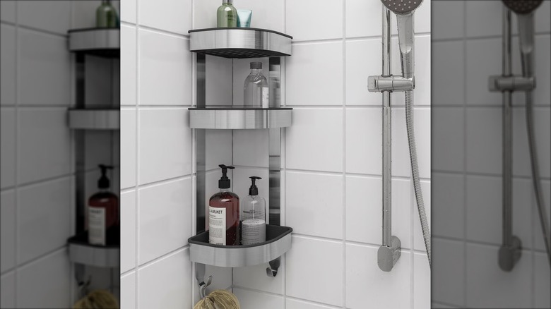 Shampoo and conditioner bottles sit on a stainless steel BROGRUND Corner wall shelf unit installed in a shower