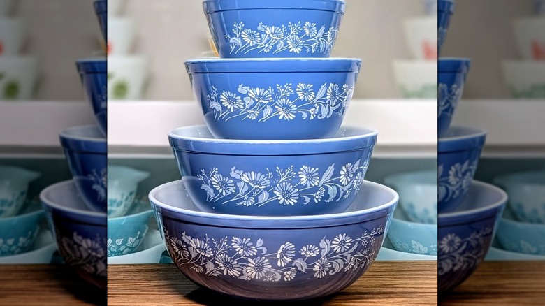 A set of four Pyrex mixing bowls in the blue Colonial Mist pattern