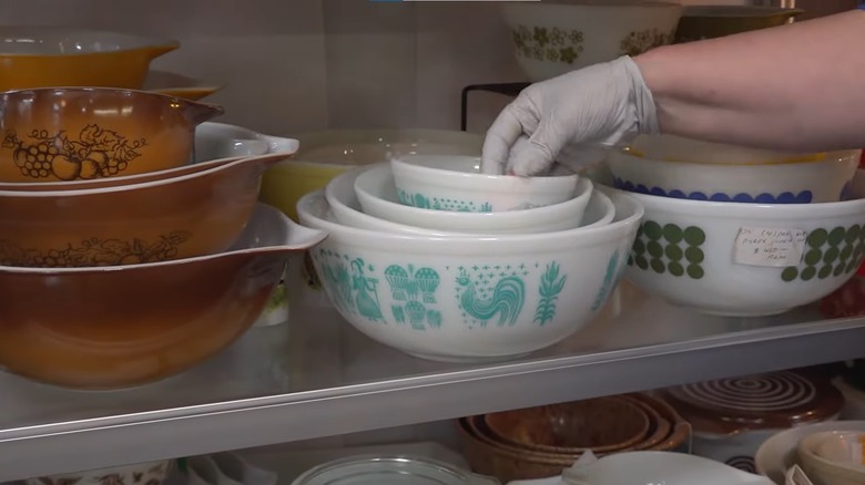 A selection of Pyrex sets for sale in a thrift shop