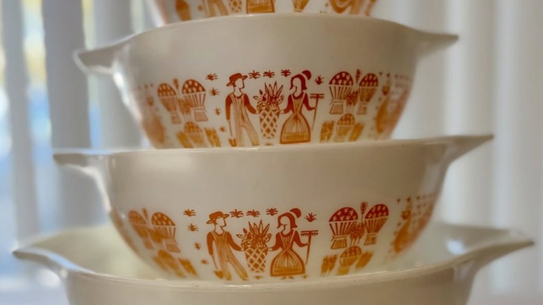 A set of four Pyrex Cinderella mixing bowls in the orange or pumpkin Butterprint pattern