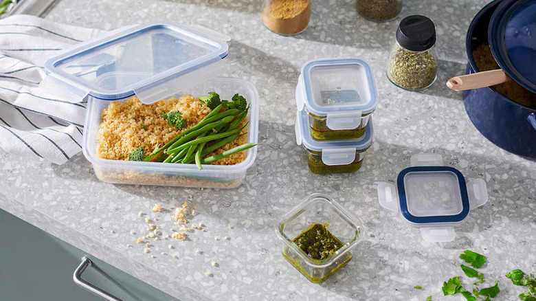 Several IKEA 365+ Food containers on a gray kitchen countertop