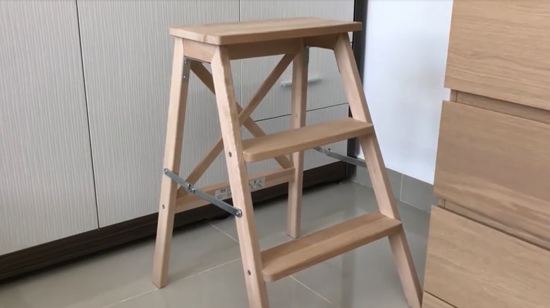 Wooden IKEA step ladder in an unfolded position.