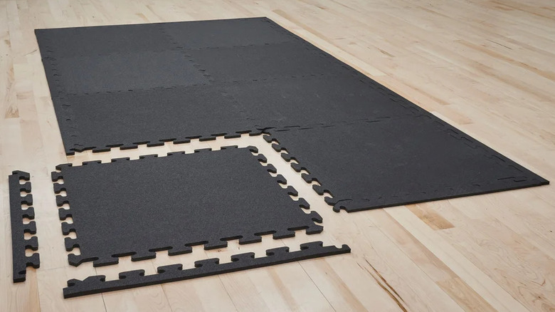 Matter recycled rubber floor tiles on a wood floor