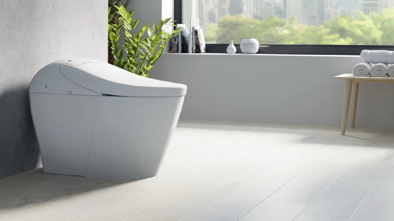 The TOTO Washlet G5A integrated smart toilet in a minimalist bathroom