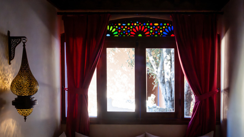 A stained glass window in an alcove