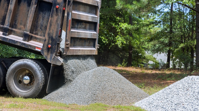 piles of gravel in a yard